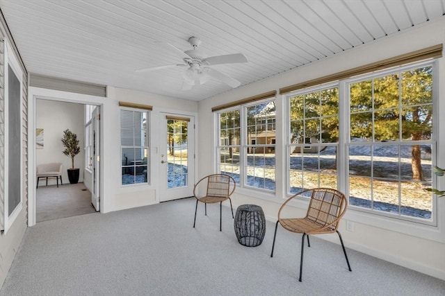 sunroom featuring ceiling fan