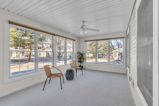 sunroom / solarium featuring ceiling fan