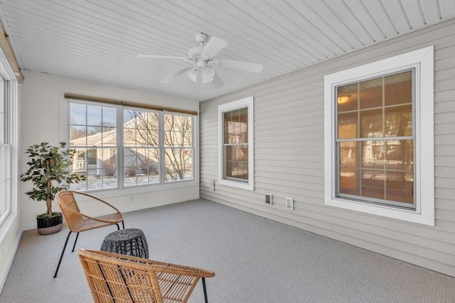 sunroom featuring ceiling fan