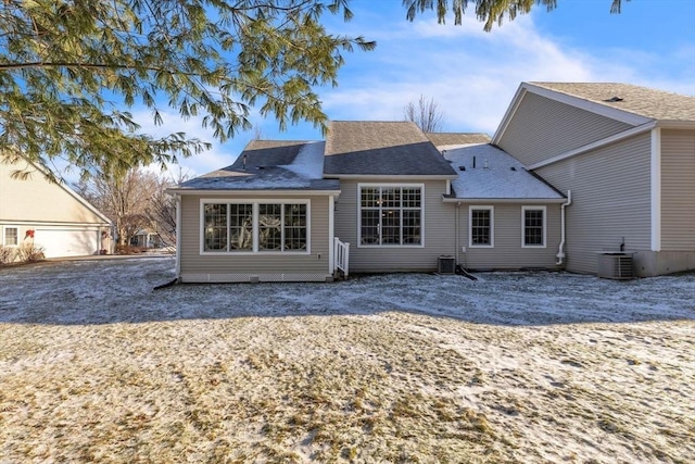 rear view of property with central air condition unit