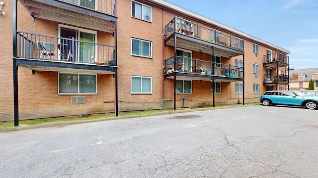 view of property featuring uncovered parking