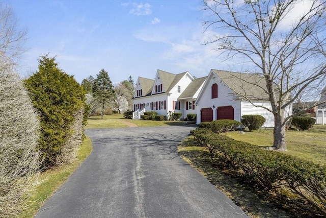 view of street featuring aphalt driveway