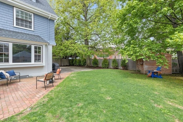 view of yard featuring a fenced backyard and a patio