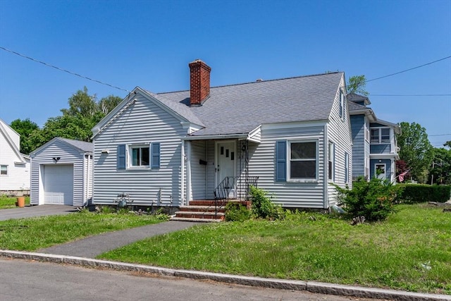 59 Milk Ave, Methuen, MA 01844 - view of front of property featuring a chimney, a front yard, and driveway
