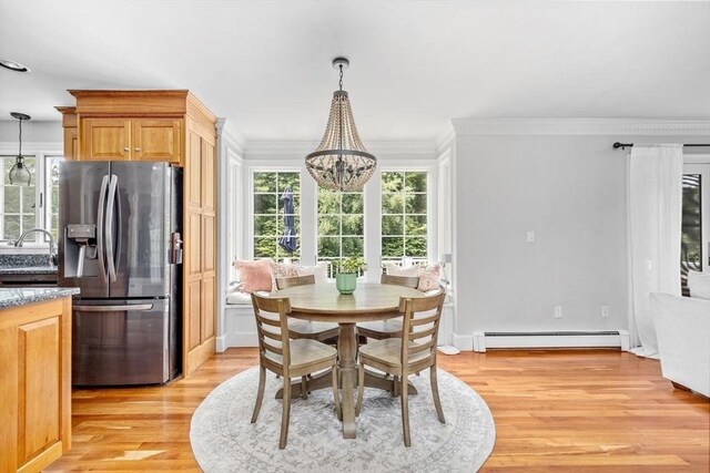 17 Maplewood Dr, Hanover, MA 02339 - dining room featuring baseboard heating, a chandelier, crown molding, and light wood-style flooring