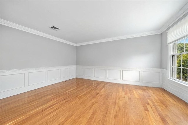 17 Maplewood Dr, Hanover, MA 02339 - empty room featuring light wood-style floors, crown molding, and a wainscoted wall