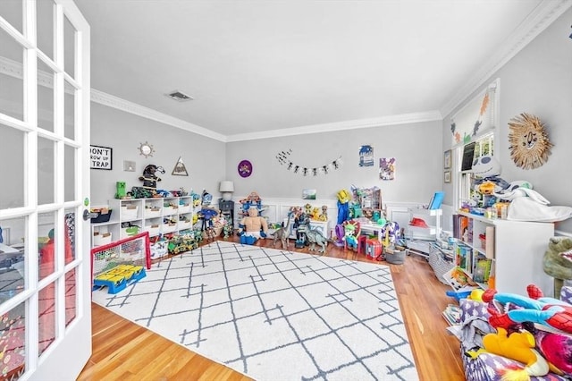 17 Maplewood Dr, Hanover, MA 02339 - game room featuring wood finished floors, crown molding, and a wainscoted wall