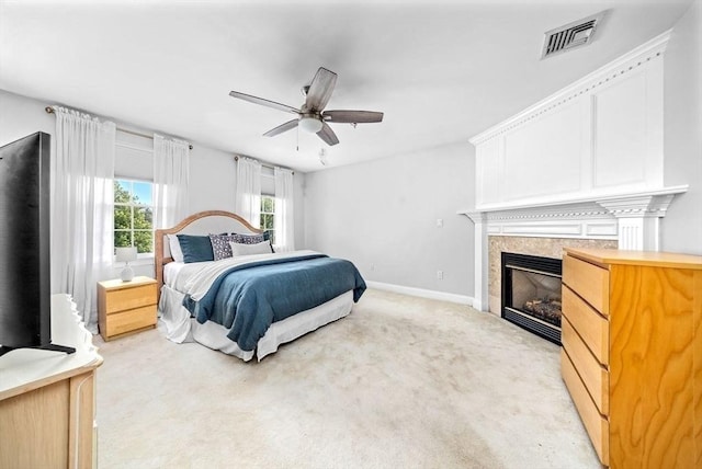 17 Maplewood Dr, Hanover, MA 02339 - bedroom with light carpet, a glass covered fireplace, and a ceiling fan