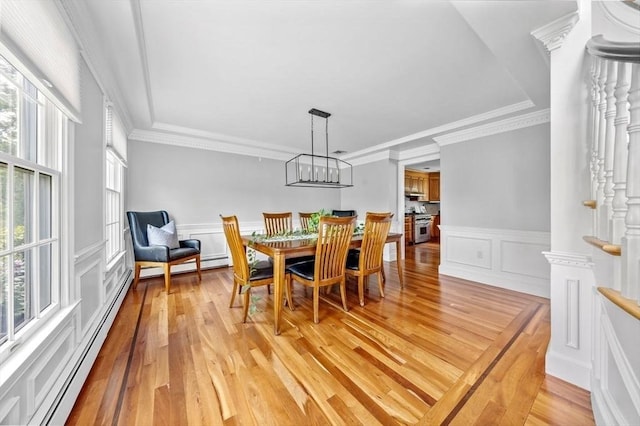 17 Maplewood Dr, Hanover, MA 02339 - dining area featuring a baseboard heating unit, plenty of natural light, light wood-style flooring, a decorative wall, and wainscoting