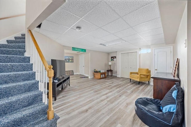 17 Maplewood Dr, Hanover, MA 02339 - living area featuring wood finished floors, stairway, and a paneled ceiling