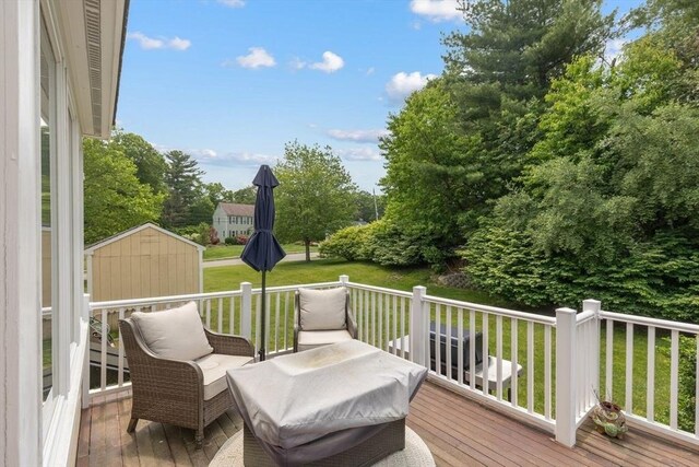 17 Maplewood Dr, Hanover, MA 02339 - wooden deck featuring a storage unit and a lawn