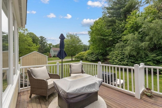 17 Maplewood Dr, Hanover, MA 02339 - wooden deck with a storage unit, view of wooded area, and a lawn