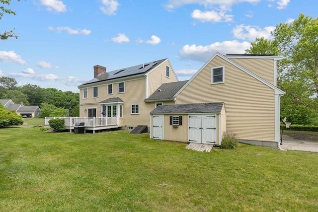 17 Maplewood Dr, Hanover, MA 02339 - back of house with a deck, a lawn, and a storage unit