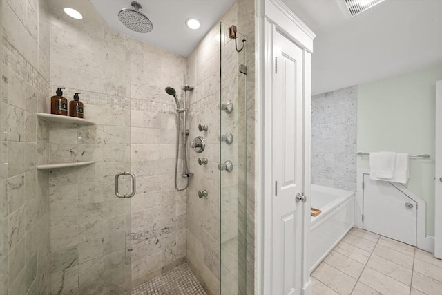 bathroom featuring a shower stall, a garden tub, tile patterned floors, and recessed lighting