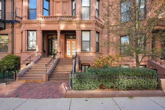 property entrance with french doors and a balcony