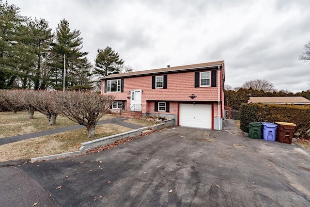 bi-level home featuring a garage