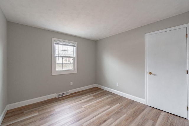 unfurnished room featuring light hardwood / wood-style floors