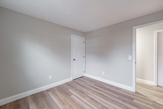 unfurnished room with light hardwood / wood-style floors