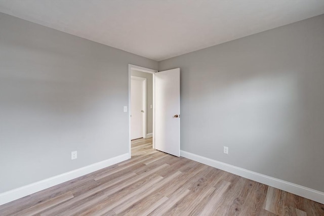 spare room with light wood-type flooring