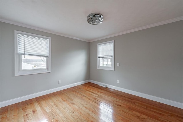 unfurnished room with crown molding and light hardwood / wood-style floors