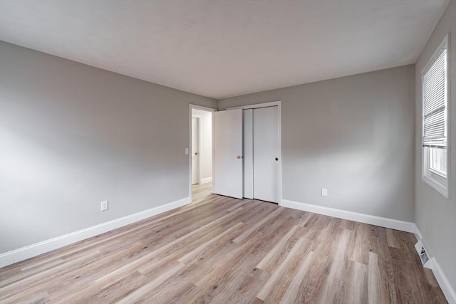 spare room with light wood-type flooring