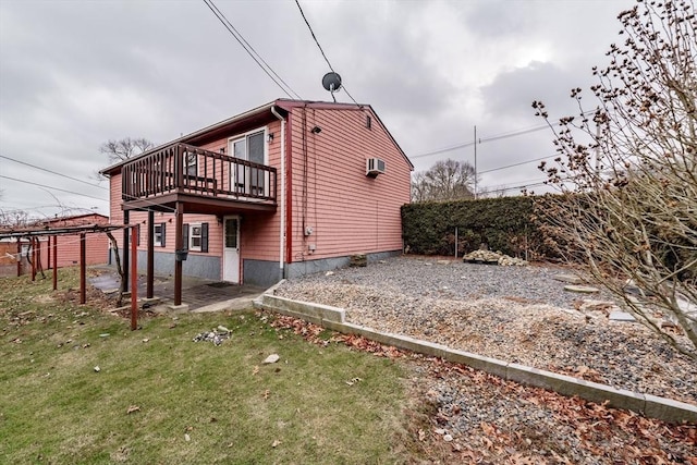 view of home's exterior with a wooden deck and a yard