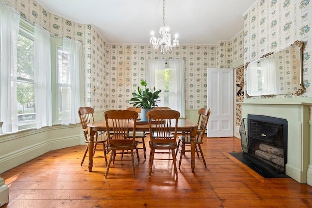 127 E St, East Bridgewater, MA 02333 - dining space with wood-type flooring, plenty of natural light, a chandelier, crown molding, and wallpapered walls