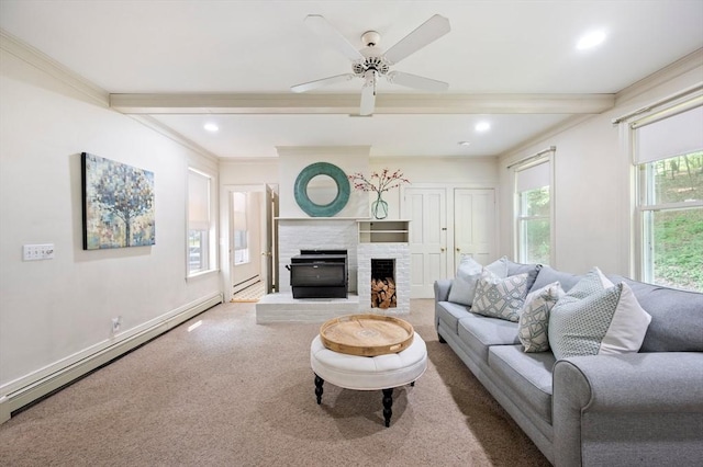 127 E St, East Bridgewater, MA 02333 - carpeted living area featuring beam ceiling, crown molding, a ceiling fan, a fireplace, and baseboard heating