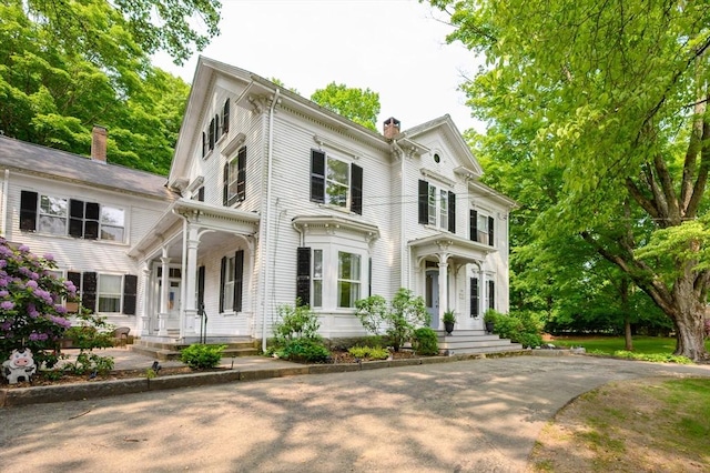 127 E St, East Bridgewater, MA 02333 - view of front of property with a chimney and covered porch