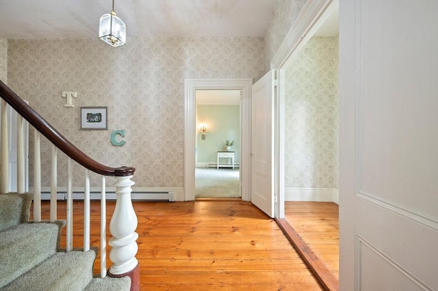 127 E St, East Bridgewater, MA 02333 - foyer featuring light wood-type flooring, wallpapered walls, baseboard heating, and stairs