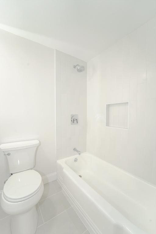 80 Main St Unit 4, Malden, MA 02148 - full bath featuring tile patterned floors, toilet, shower / bathtub combination, and baseboards