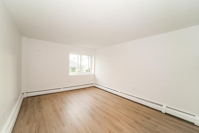 80 Main St Unit 4, Malden, MA 02148 - additional living space featuring wood finished floors, a baseboard heating unit, and baseboards