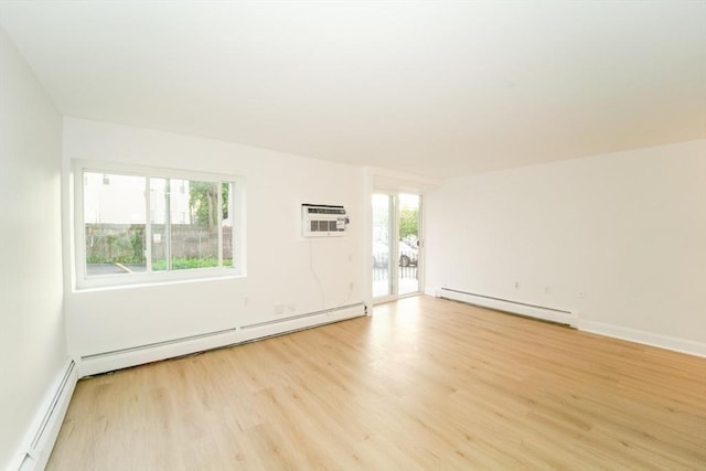 80 Main St Unit 4, Malden, MA 02148 - unfurnished room with a baseboard heating unit and light wood-style floors