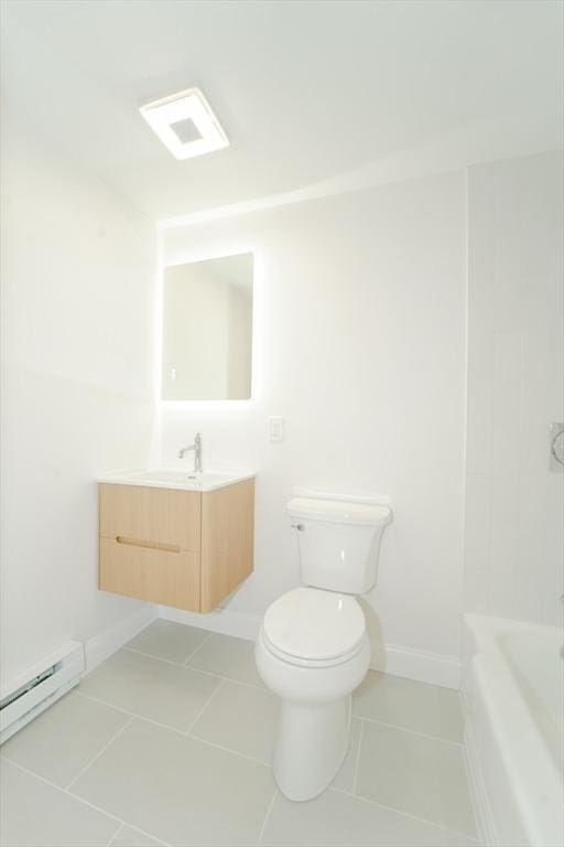 80 Main St Unit 4, Malden, MA 02148 - bathroom with baseboard heating, vanity, tile patterned floors, toilet, and baseboards