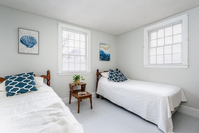 carpeted bedroom featuring baseboards