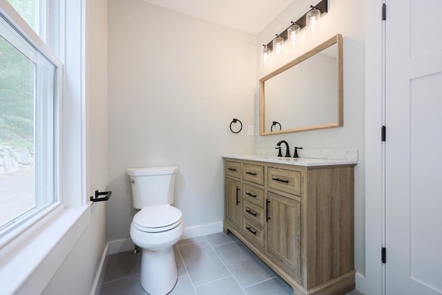 93 Hollis Rd, Plymouth, MA 02360 - bathroom with baseboards, toilet, vanity, and tile patterned flooring