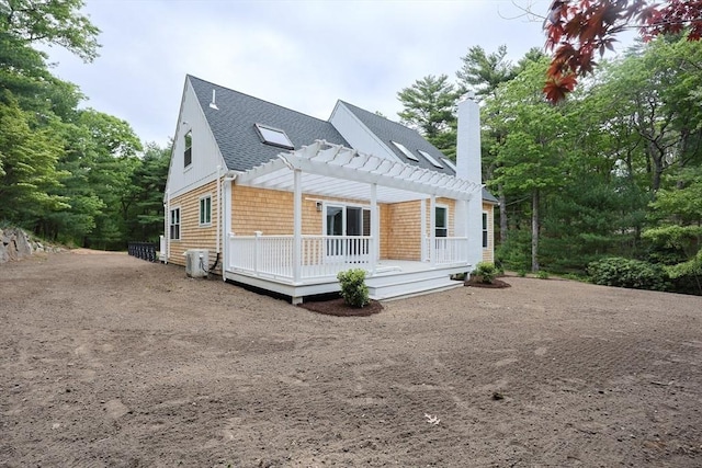 93 Hollis Rd, Plymouth, MA 02360 - view of front of house with a pergola, a shingled roof, a chimney, and a deck