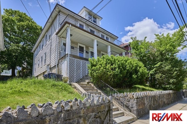 150 Nonantum St, Boston, MA 02135 - view of front facade featuring stairway and a porch