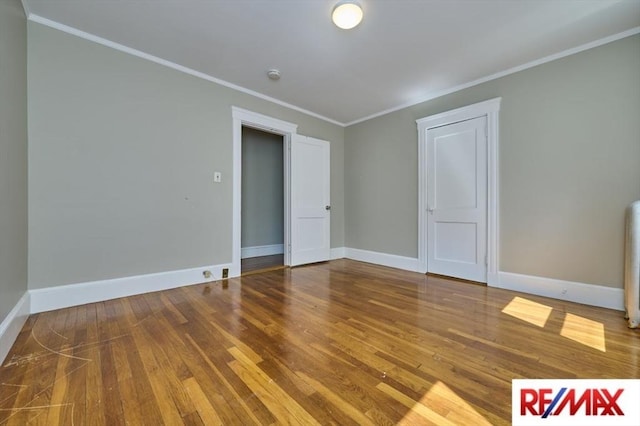 150 Nonantum St, Boston, MA 02135 - unfurnished room featuring wood finished floors, ornamental molding, baseboards, and a smoke detector
