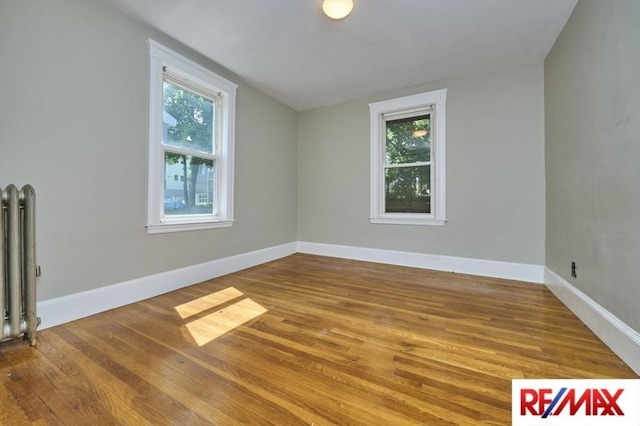 150 Nonantum St, Boston, MA 02135 - empty room featuring healthy amount of natural light, wood finished floors, and baseboards