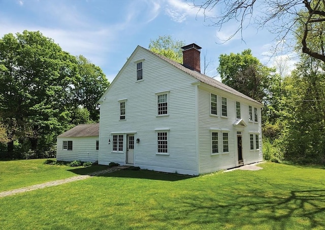 164 Worcester Rd, Westminster, MA 01473 - rear view of house with a chimney and a lawn