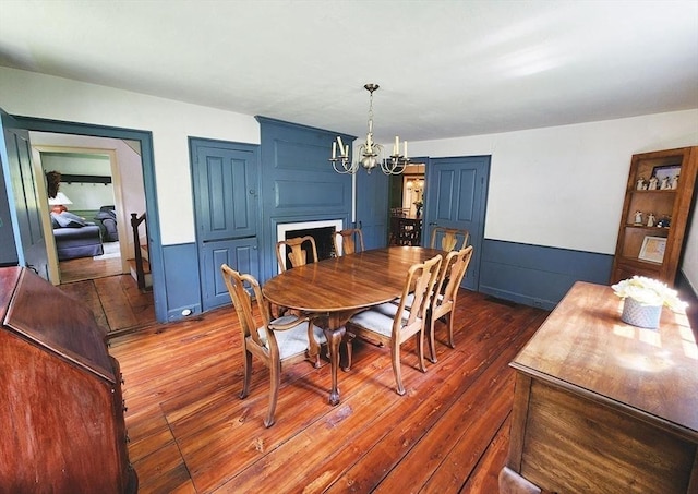 164 Worcester Rd, Westminster, MA 01473 - dining area featuring wood-type flooring, a chandelier, and a wainscoted wall