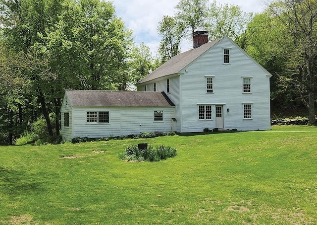 164 Worcester Rd, Westminster, MA 01473 - rear view of house with a chimney and a lawn