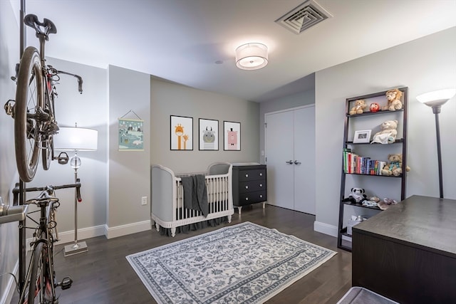 home office with dark hardwood / wood-style flooring