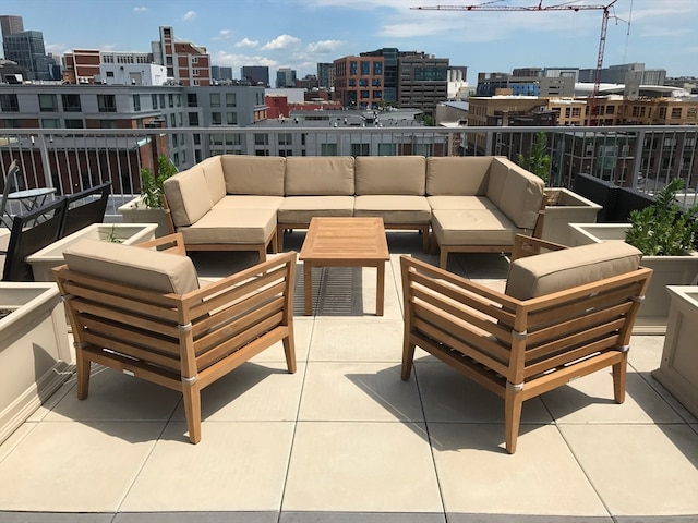 view of patio with a balcony and an outdoor living space