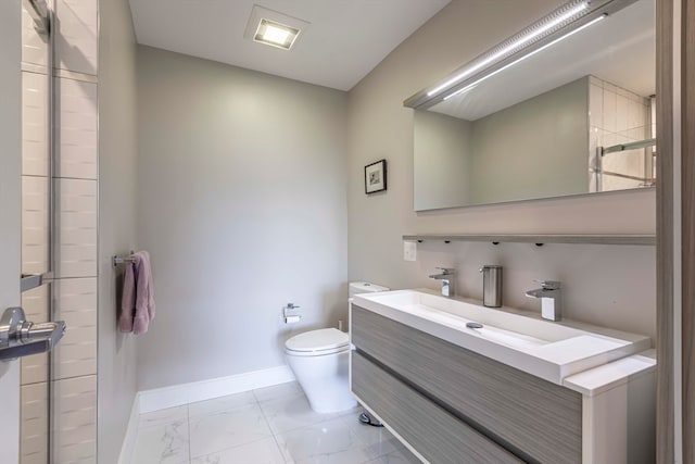 bathroom featuring toilet, a shower with door, and vanity