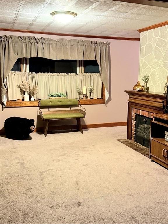 interior space featuring ornamental molding, a fireplace, and baseboards