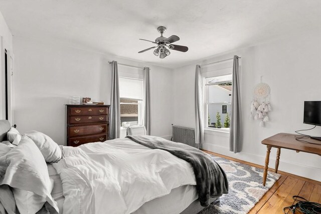381 Hunnewell St Unit 381, Needham, MA 02494 - bedroom featuring wood finished floors, baseboards, and ceiling fan