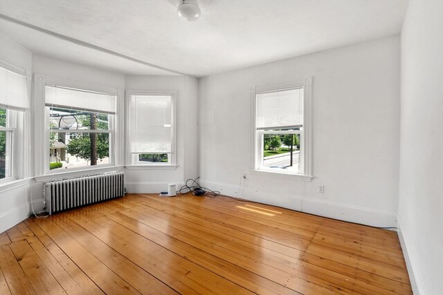 381 Hunnewell St Unit 381, Needham, MA 02494 - unfurnished room featuring radiator, light wood-style flooring, and baseboards