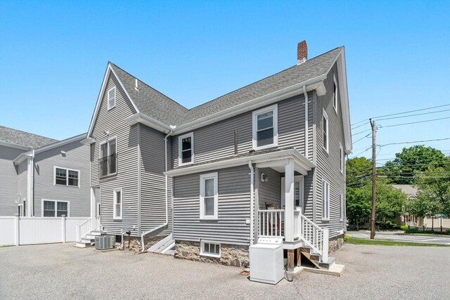 381 Hunnewell St Unit 381, Needham, MA 02494 - rear view of house featuring a chimney and central AC